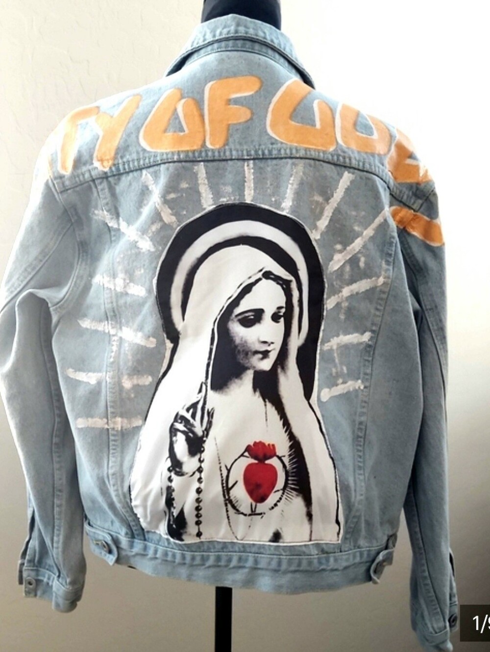 Light Blue Painted Denim Unisex Jacket with religious graphic sewn-in.